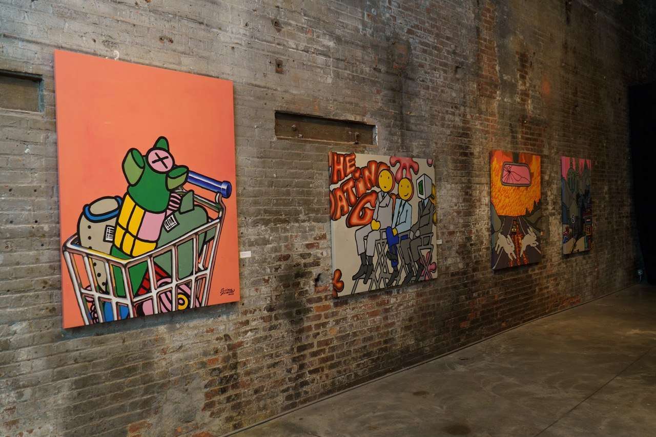 Exhibition paintings on brick wall